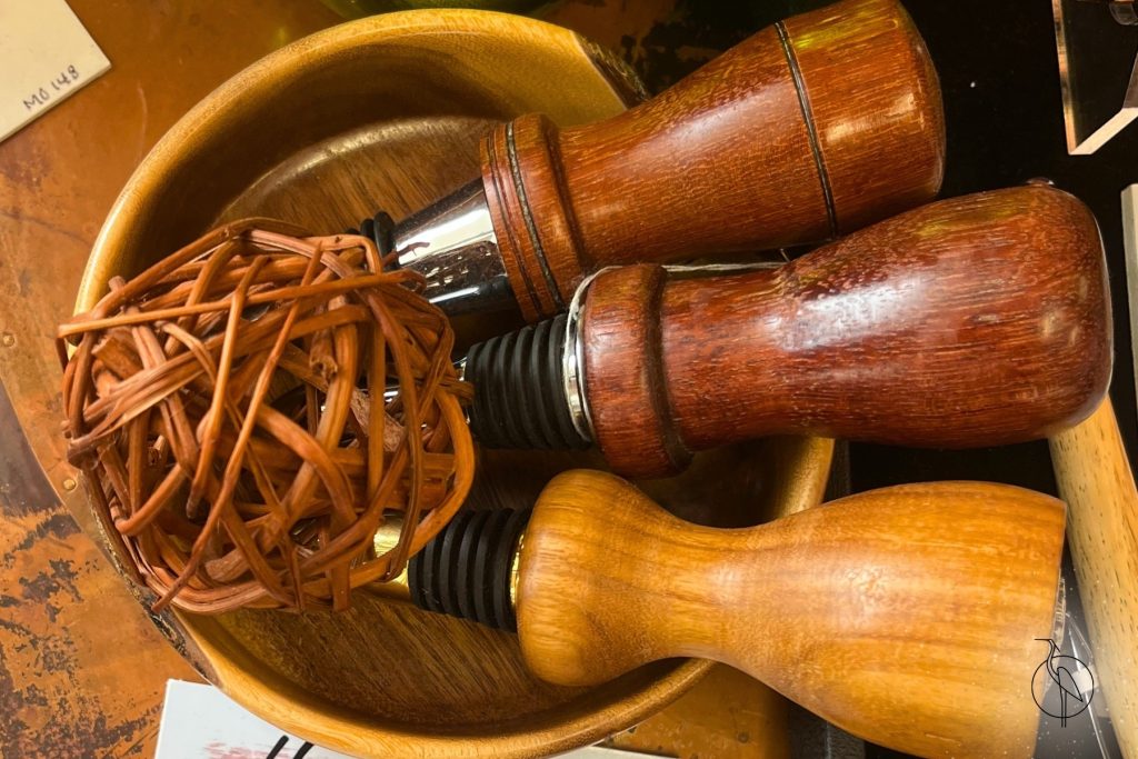 A set of wine stoppers in a bowl